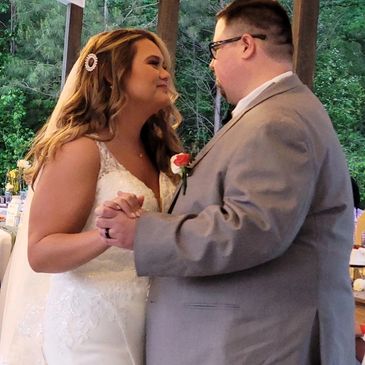 Bride and groom share a loving dance at their wedding.