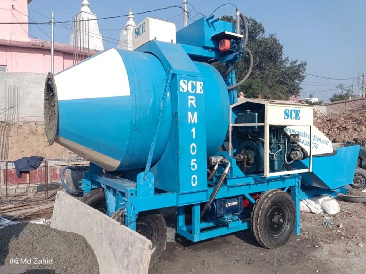 REVERSIBLE CONCRETE DRUM MIXER WITH DIESEL ENGINE WORKING AT CONSTRUCTION SITE IN INDIA