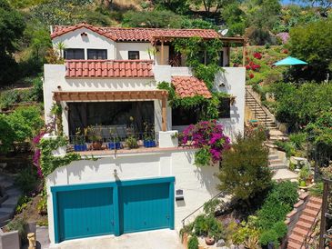 3 Bedroom, 2 Bath 3 Story Spanish Colonial Revival home is an oasis from the fast-paced city life.