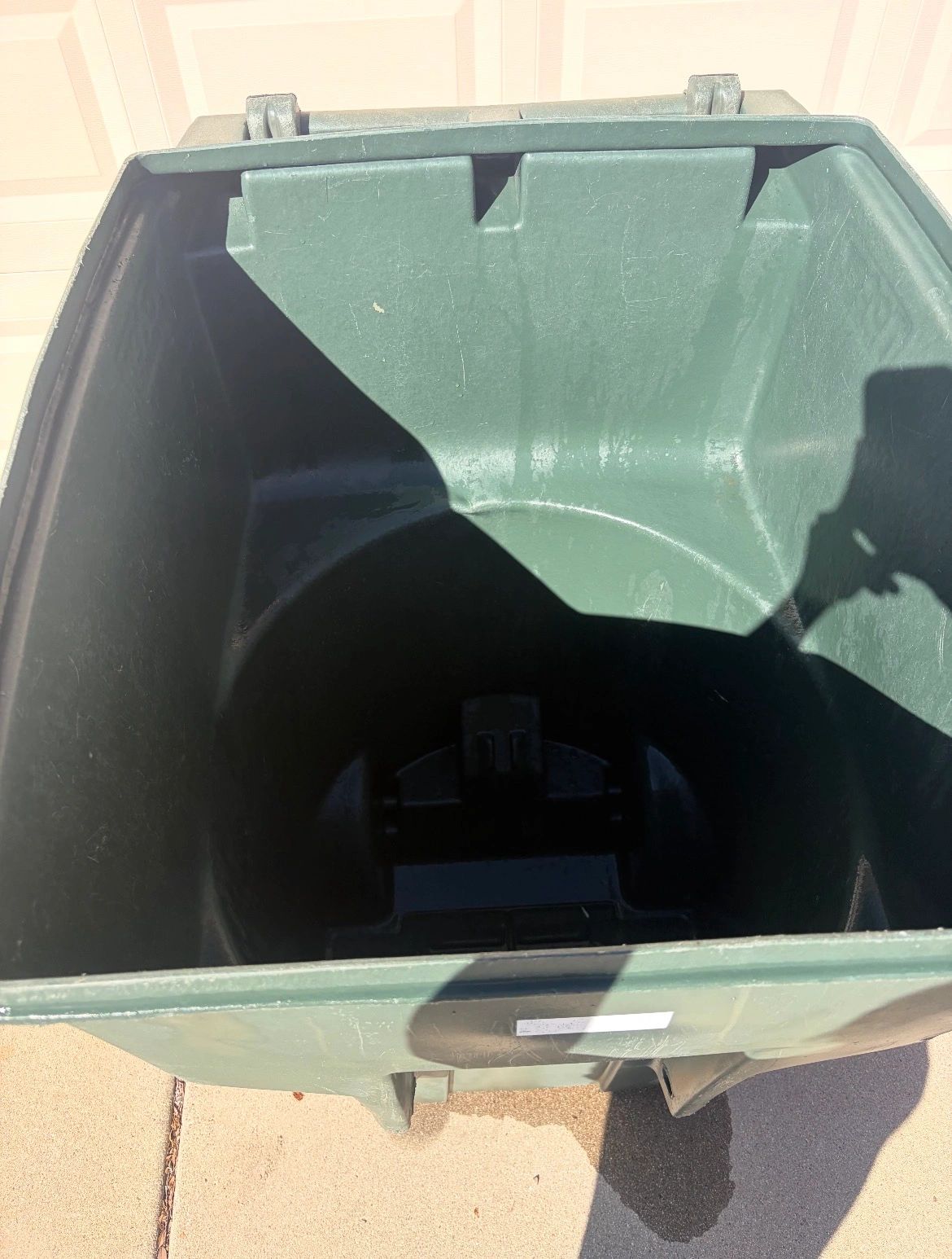 Trash bin free of grime and dirt after Skyros Pressure Washing service.