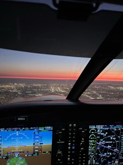 Flight deck of trainer aircraft at sunset.
