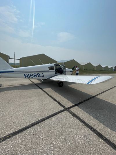 Private Pilot pre-flighting aircraft.