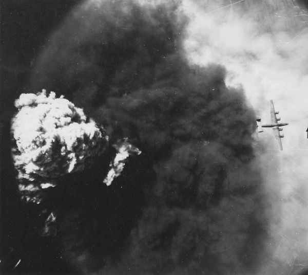 Dark smoke from aerial explosion.
