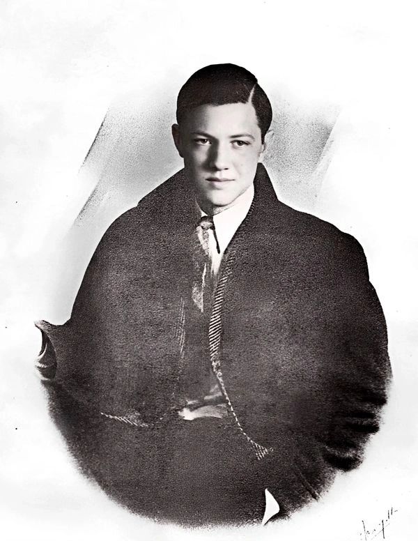 Man wearing dark heavy cloak.
