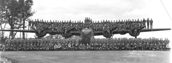 Massive squadron posing on bomber.