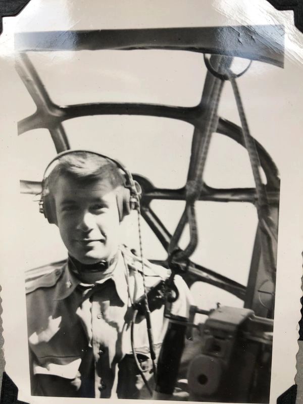  Pilot inside aircraft cockpit station.