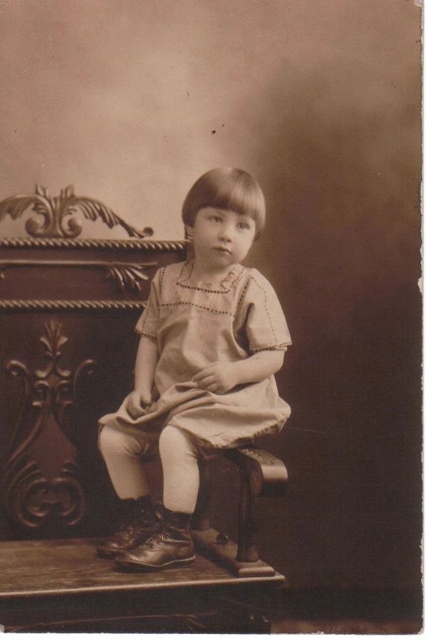 Small child sitting for portrait.
