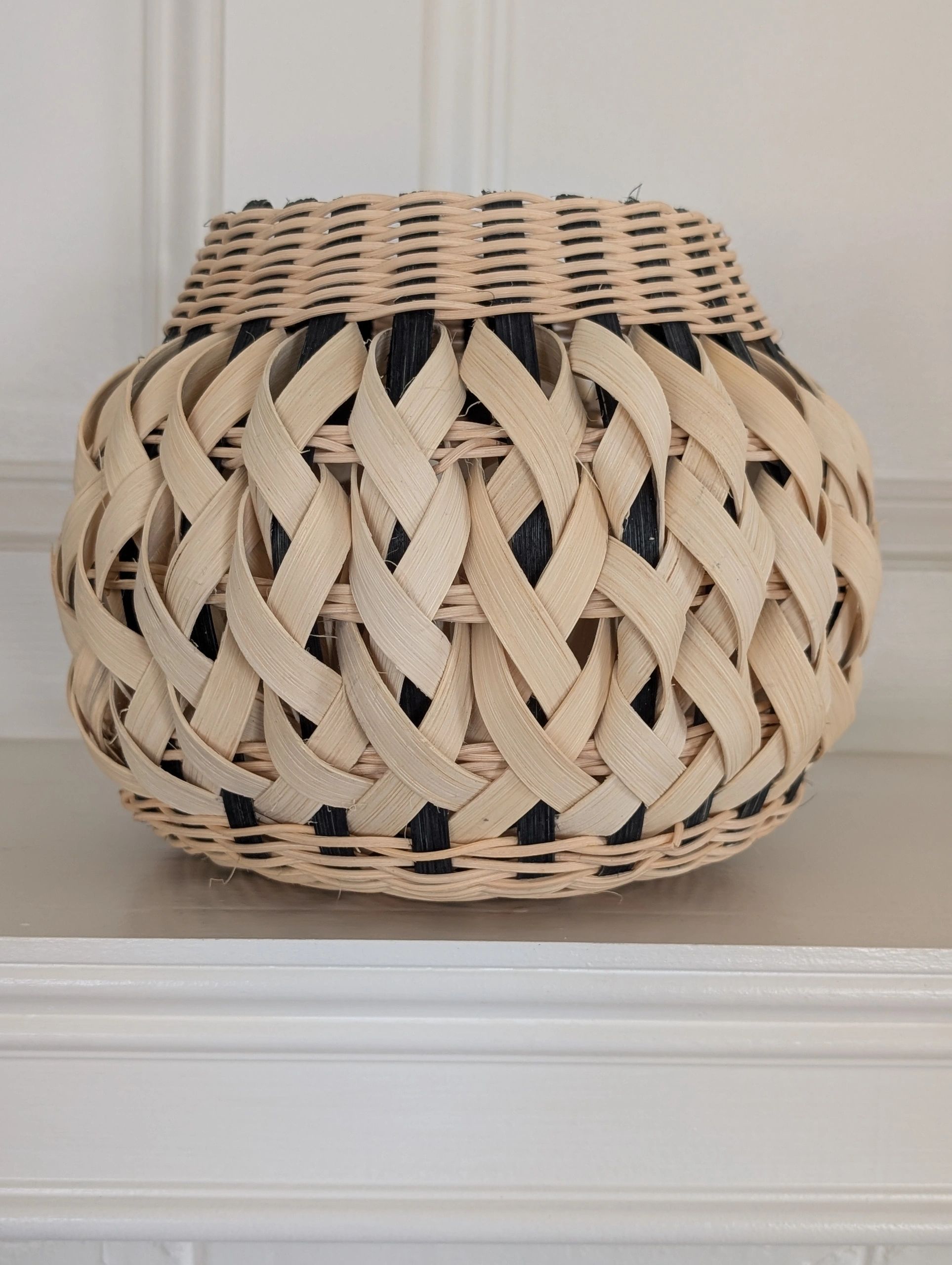 Handwoven basket in the style of Native American pottery