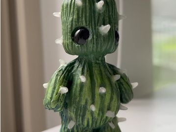 a small cactus man sculpture