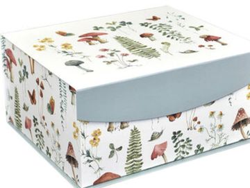 A colorful box containing a diy sewing kit to make a Cairn terrier/ Toto plush toy
