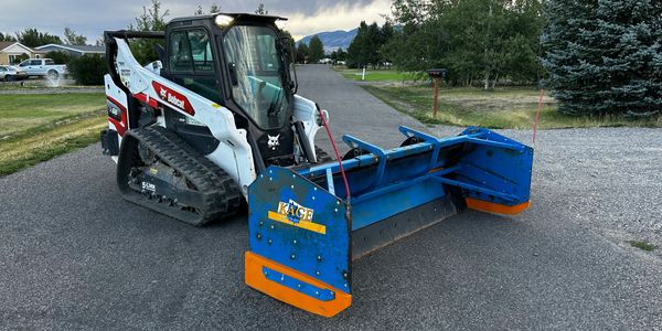 Bobcat skid steer and 9' kage snow plow ready to plow your snow to keep your business running!