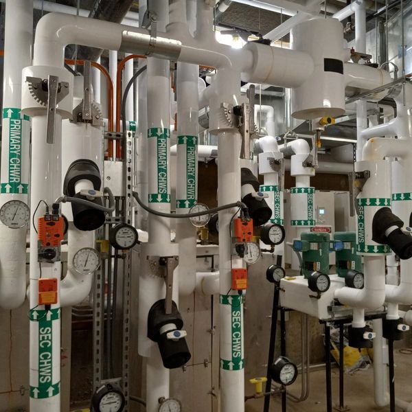 White pipes and gauges in an industrial setting.
