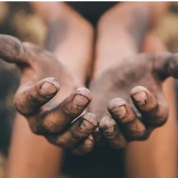 Close-up of dirty, extended hands.