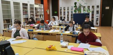 Students studying in a library classroom.