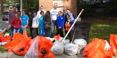 Participants pose with bags of litter--trash and compostables--from along the NW Branch.