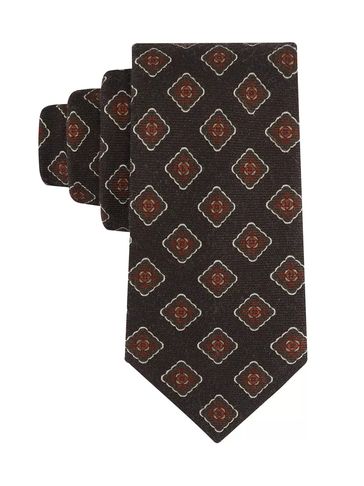 Brown tie with red and white geometric floral pattern.