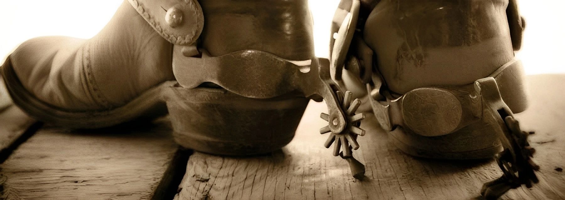 Close-up of leather riding boots and spurs