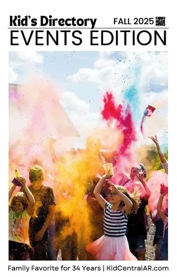 Kids joyfully throwing colorful powder at an outdoor event.