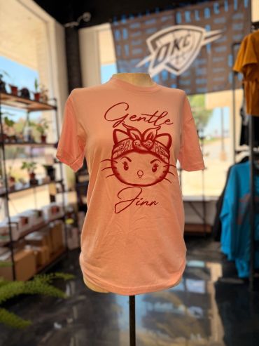 Peach T-shirt with cat graphic and 'Gentle Jinn' text.