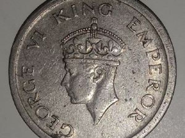 Coin featuring King George VI with crown and title.