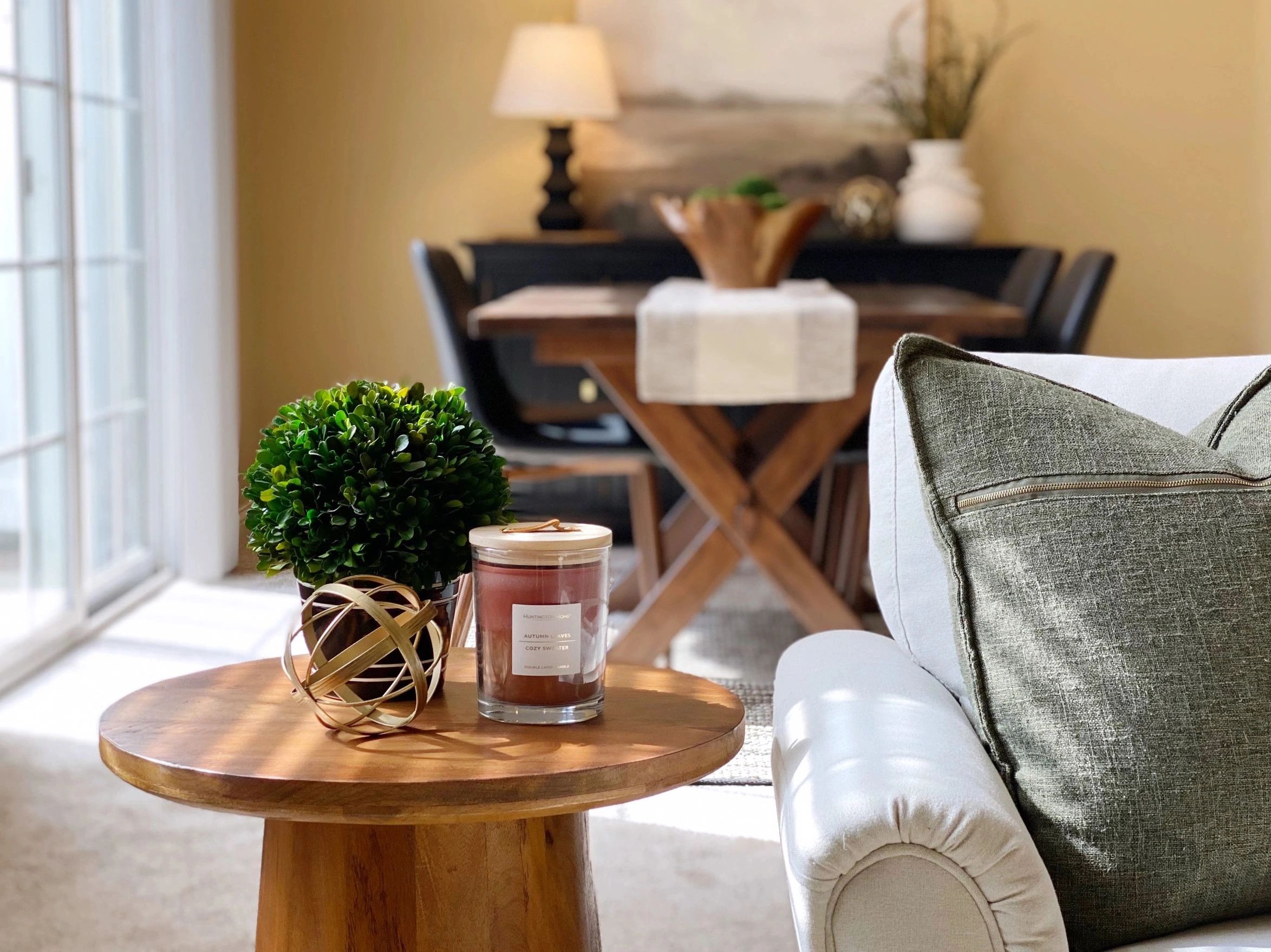 Updated living room with sofa, tables, dining room, accessories, decor in staged home in Dublin Ohio