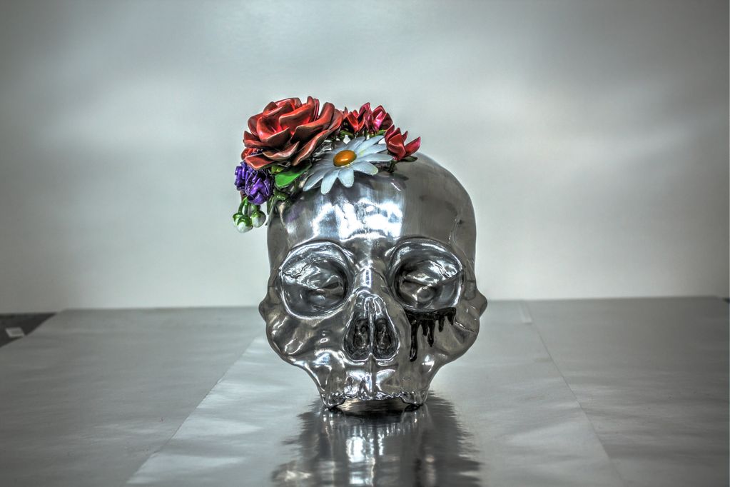 A juxtaposition of life & death + growth & pain. Adorned with a floral crown inspired by Frida Kahlo