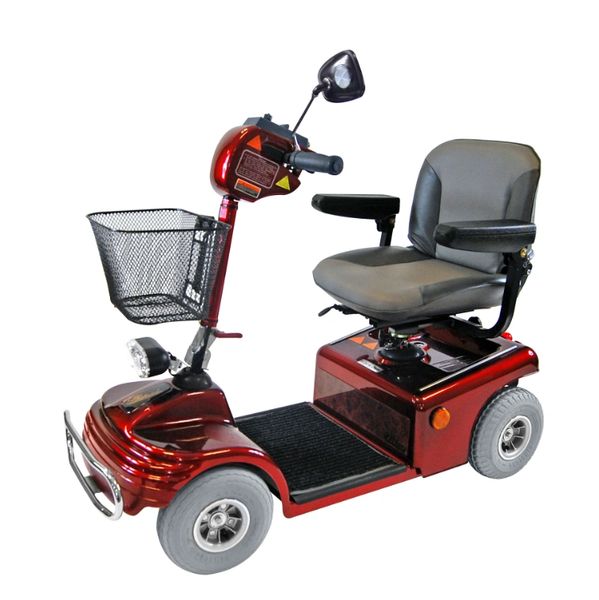 Red mobility scooter with padded seat and front basket.