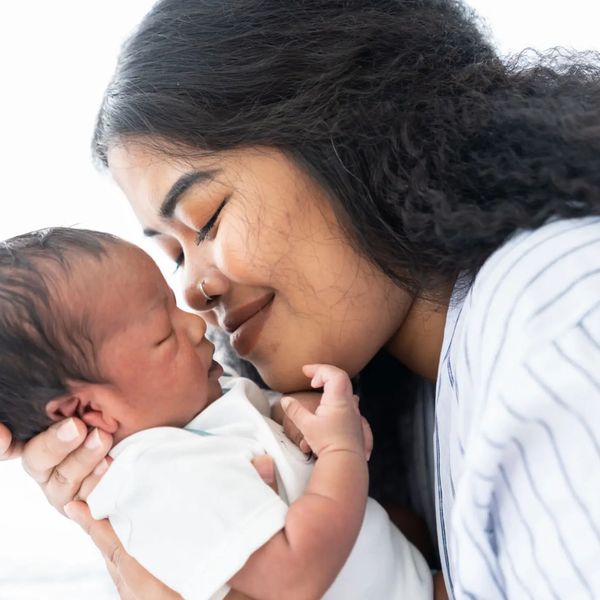 A tender moment between a mother and her newborn baby.