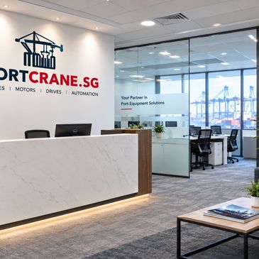 Modern office reception with PortCrane.SG branding.