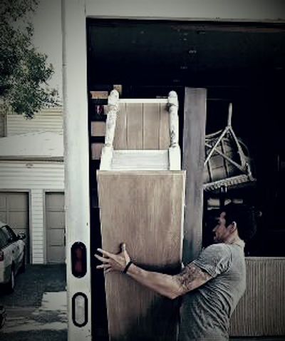 Our owner moving an armoire