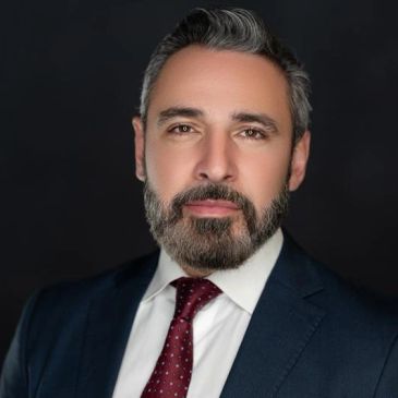 Professional man in suit with a confident expression.
