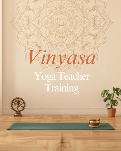 Calm yoga studio with Vinyasa teacher training text.