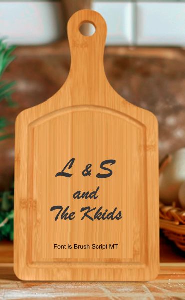 Wooden cutting board with custom text in Brush Script MT font.