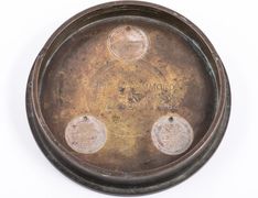 Lt. Commander Hammond Wardroom ashtray, three 1945 surrender coins recessed into inside shell casing