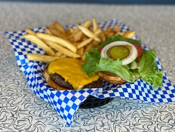 Fresh cheeseburger with fries and all the fixins