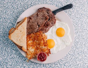 Hand cut ribeye with 2 eggs, hashbrowns and toast