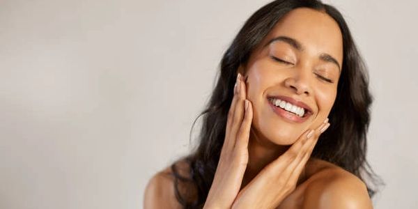 A girl smiling showing her teeth