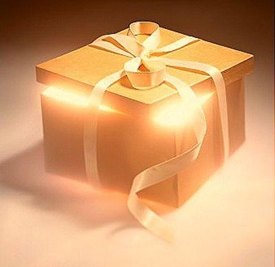 Glowing gift box wrapped with ribbon.