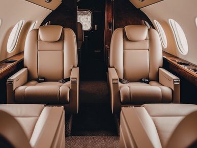 Luxurious leather seats in a private jet cabin.