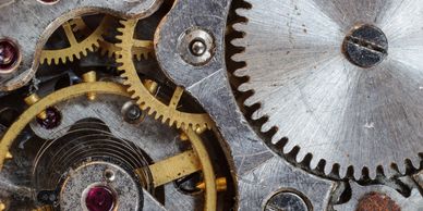 Close-up of mechanical gears and springs.