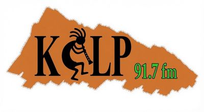Logo of KPLP 91.7 FM radio station with Kokopelli figure.
