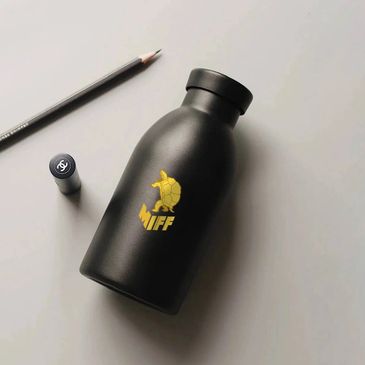 Black bottle with a yellow turtle logo and the word 'MIFF'.
