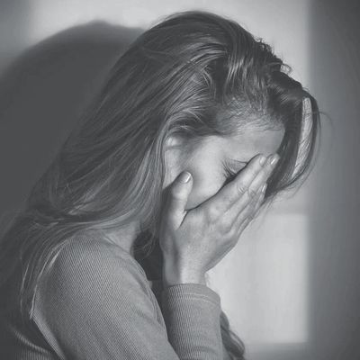 Sad woman escaping domestic abuse