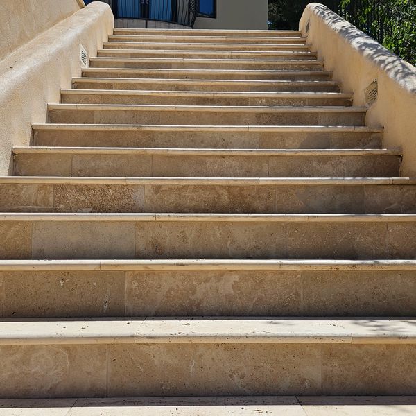 Custom built stair case with tile paver lining.