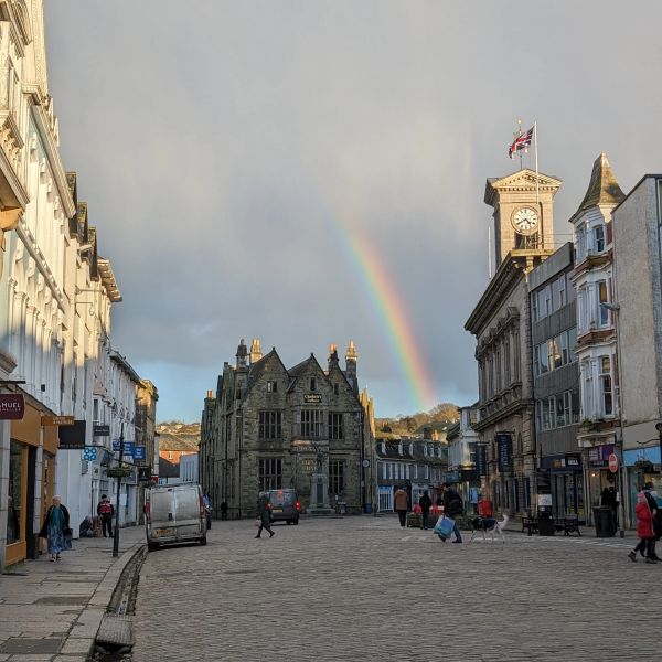 Rainbow over historic town of Truro. Square with clock tower. Cornwall.