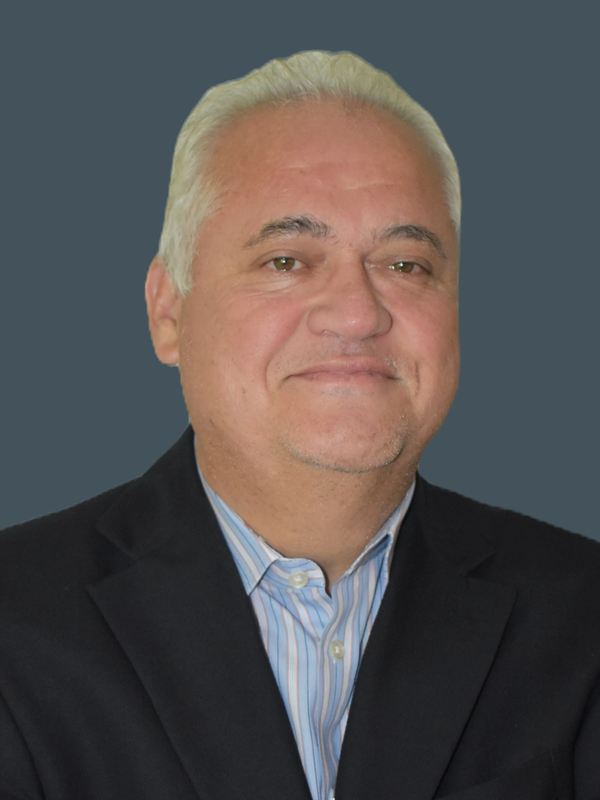 Middle-aged man with gray hair in a suit.