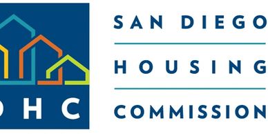 Logo of the San Diego Housing Commission with colorful house icons.