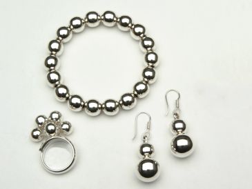 Shiny silver bead jewelry set with bracelet, ring, and earrings.