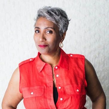 Tracy J. Moss in red vest