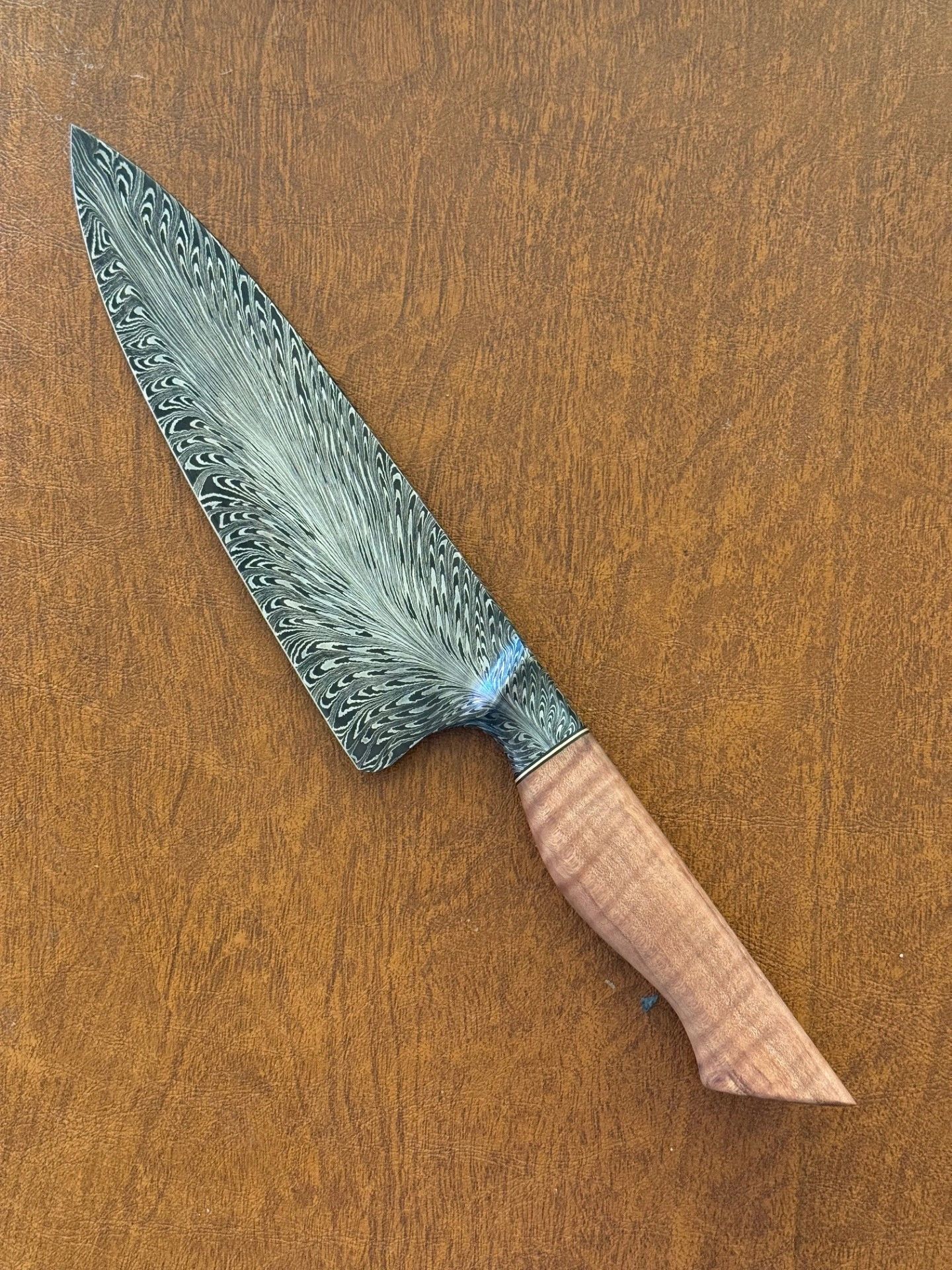 Functional art: Damascus steel knife with wood handle.

